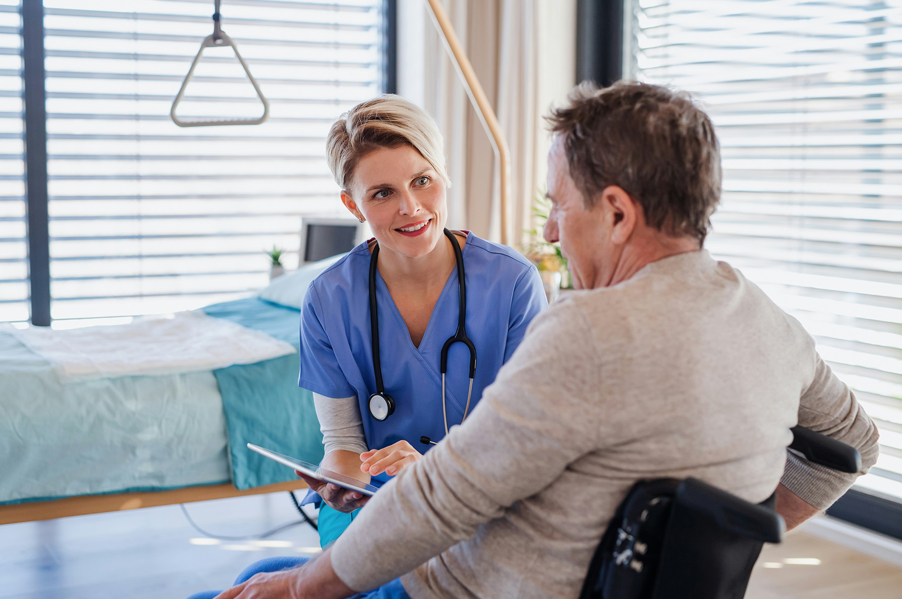 Compassionate hospice caregiver supporting a patient with dignity and personalized care in a calm, home-like setting